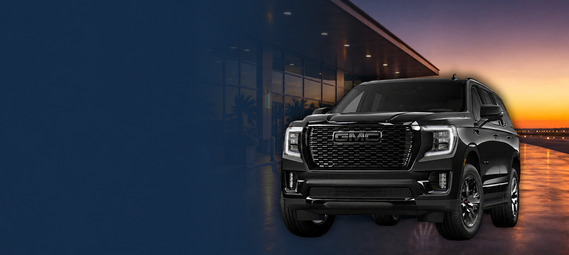 SUV GMC Yukon de lujo utilizada para servicio de transportación privada premium en Puerto Rico frente a un edificio moderno al atardecer.